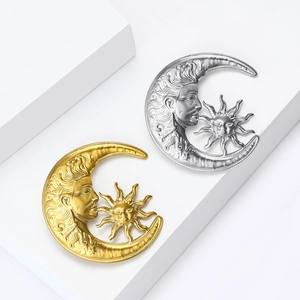 Minimalist sun and moon face brooches in gold and silver with vintage metallic texture