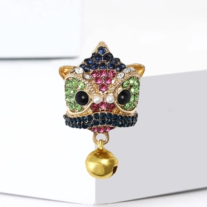 Exquisite Chinese lion dance brooch with colorful rhinestones and gold bell pendant charm