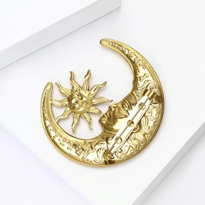 Celestial gold sun and moon brooch pin with vintage liquid metal relief on white stone