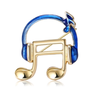 Golden headphone and musical notes brooch with dark blue enamel finish on white background