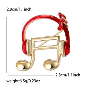 Minimalist headset and musical note brooch with red enamel in gold-tone plating
