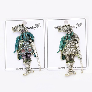 Macro view of vintage horse knight shield brooches with colorful cubic zirconia inlays