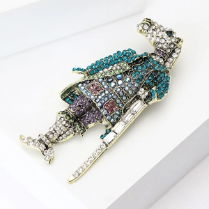 Macro detail of vintage horse knight shield brooch with colorful zircons and gold finish