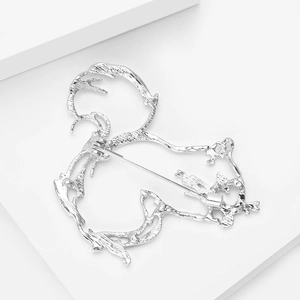 Detail view of the silver squirrel brooch back with a secure rotating safety pin clasp