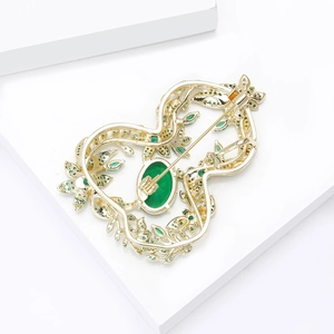 Luxury gold hollow gourd brooch with green zircon inlay and detailed back safety pin