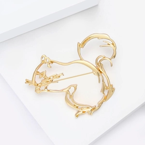 Detailed view of the golden squirrel brooch back showing the metal pin and clasp texture