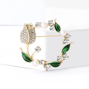 Luxury tulip wreath brooch with gold finish, pearls and crystals on a white display