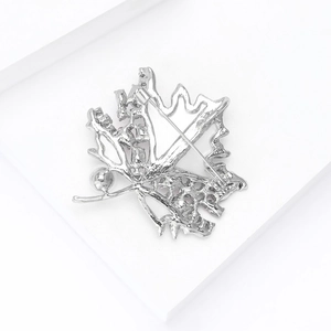 Detailed back view of maple leaf brooch with silver metal plating and pin closure