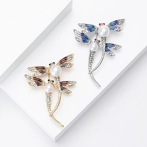 Broche libellule exquise en émail avec perles et cristaux en finitions or et argent