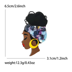 Modebrosche aus Acryl mit Silhouette einer afrikanischen Frau mit Blumenturban und Ohrringen