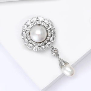 Macro detail of royal flower brooch with freshwater pearls and micro-set zircon stones