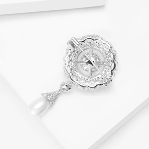 Detailed back view of vintage silver floral brooch with pin clasp and teardrop pearl