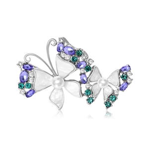 Elegant butterfly brooch with mother of pearl wings, pearls and violet crystals on silver