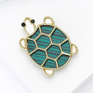 Exquisite turtle brooch with green patterned shell and gold-tone metallic outlines