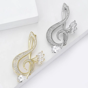 Elegant musical G-clef brooch with copper zircons in gold and silver finishes