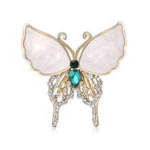 Elegant butterfly brooch with pearl wings and green gemstone set in gold plating