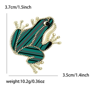 Cute green acrylic frog brooch with gold bead trim and detailed size markings