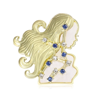 Elegante spilla dorata costellazione Vergine con strass blu e finitura in smalto