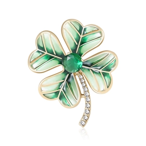 Elegant gold four leaf clover brooch with green enamel and sparkling crystals