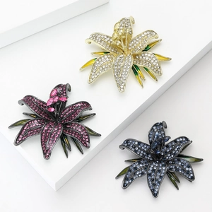 Elegant lily flower brooches with micro-set crystals and enamel on white geometric stands