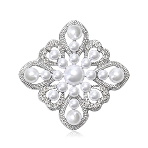 Vintage Baroque hollow pearl brooch with silver metal base and inlaid rhinestones