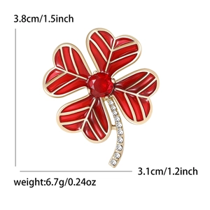 Elegant gold four-leaf clover brooch with red enamel and crystals, 3.8cm height