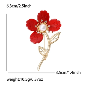 Élégante broche fleur rouge avec perle et cristaux comprenant les dimensions du produit