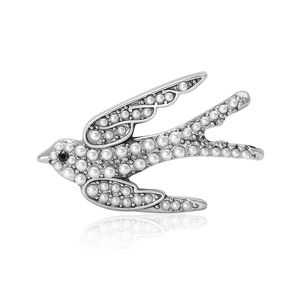 Broche élégante en forme d'hirondelle avec perles blanches et œil en pierre noire