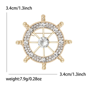 Spilla a timone minimalista con strass scintillanti e finitura in metallo dorato