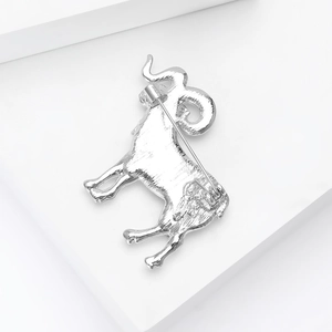 Detail view of silver Aries brooch back with pin clasp and brushed metal texture
