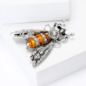 Vintage alloy honey bee brooch with silver rhinestones and orange enamel details