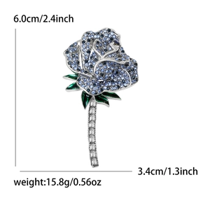 Elegant rose brooch with blue crystals and green enamel detailing, 6.0cm height size