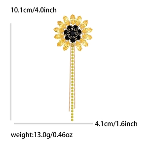 Detailed view of sunflower brooch dimensions with long gold tassels and rhinestones