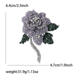 Detailed view of luxury rose brooch with purple crystals and dimensions of 6.4cm by 4.7cm