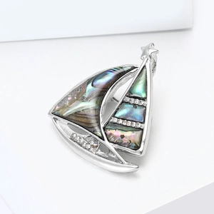 Vintage sailboat brooch with abalone shell and sparkling crystals in silver finish