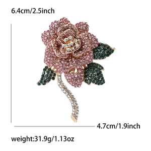 Elegant rose brooch with pink rhinestones and size labels, 6.4cm height on white background