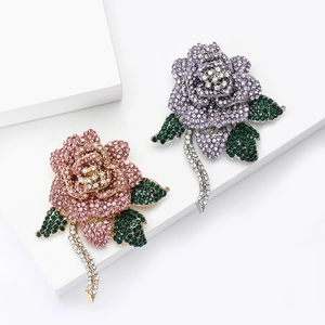 Elegant rose brooch with full crystal inlay and pink or purple petals for luxury suits