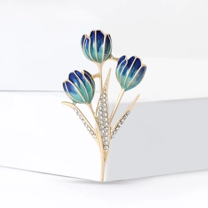 Elegant gold tulip brooch with blue enamel gradient petals and sparkling rhinestones