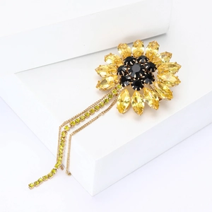 Elegant rhinestone sunflower brooch with yellow marquise petals and gold tassel chains