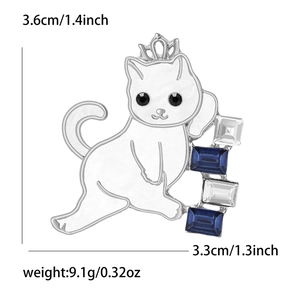 Detailed view of cat brooch with silver crown and blue crystals showing 3.6x3.3cm size