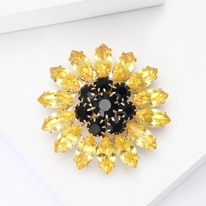 Elegant rhinestone sunflower brooch featuring yellow petals and a black crystal core