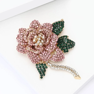 Close-up of rose flower brooch with pink rhinestones and micro-pave crystals