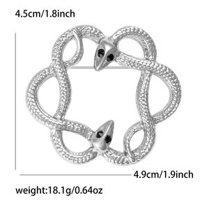 Detail of silver snake brooch showing scale texture and 4.9cm by 4.5cm dimensions