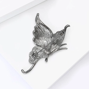 Close-up of the back structure and safety pin on the gunmetal butterfly brooch