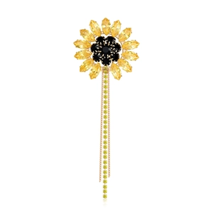 Luxurious sunflower rhinestone brooch with yellow crystals and golden chain tassels