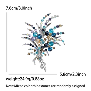 Broche fleurie élégante en alliage avec strass colorés en bleu paon et jaune ambre