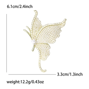 Elegant gold butterfly brooch with white pearls and size specs, 6.1cm height and 12.2g weight