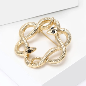 Elegant gold snake brooch with dual serpents forming a circular ring and black crystal eyes
