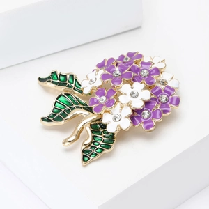 Detail of purple and white hydrangea flower brooch with crystal inlay on geometric stand