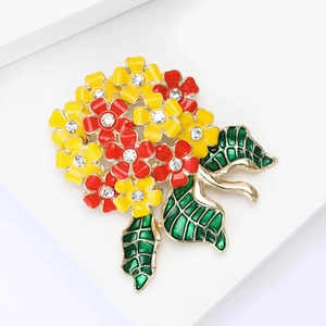 Close-up of enamel hydrangea brooch with colorful petals and crystal flower centers